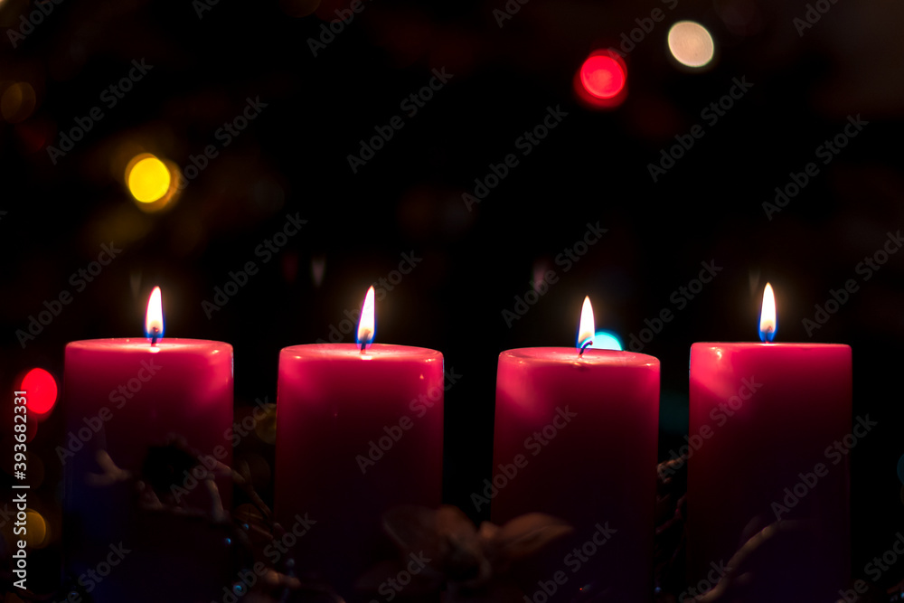 Advent candles concept with burning candles Advent candles concept with burning candles