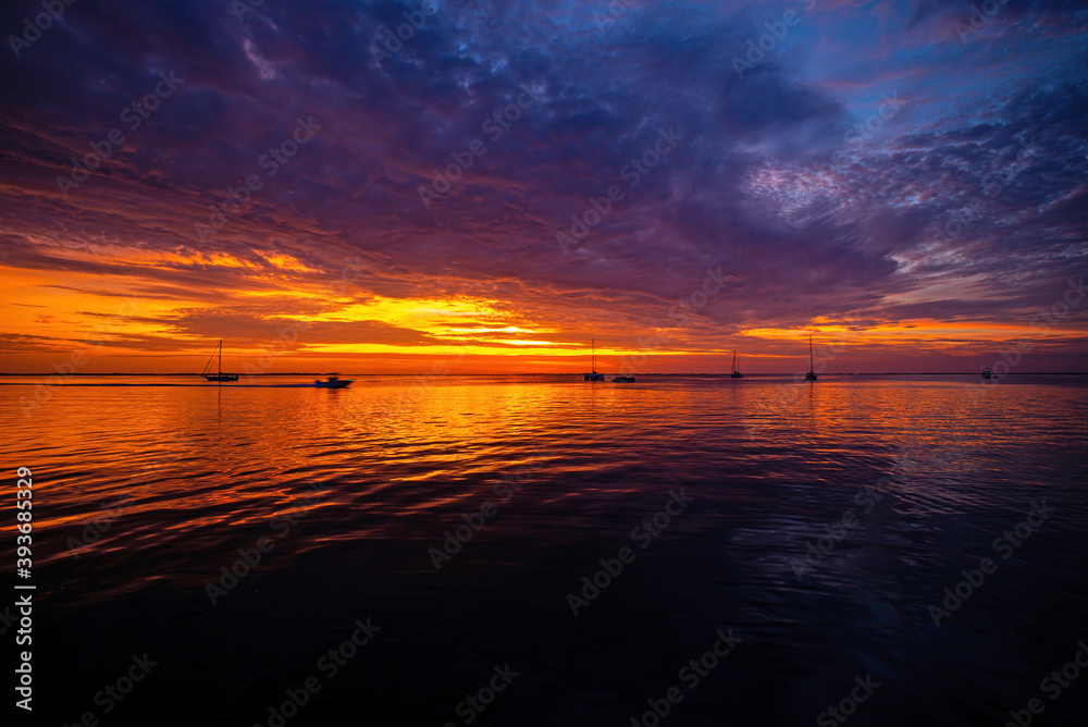 Beautiful sunrise. Ocean and sky background. Colorful horizon over the water.