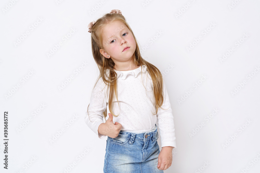 The girl shows a gesture - class. Isolated over white background. The girl shows a gesture - class. Isolated over white background.