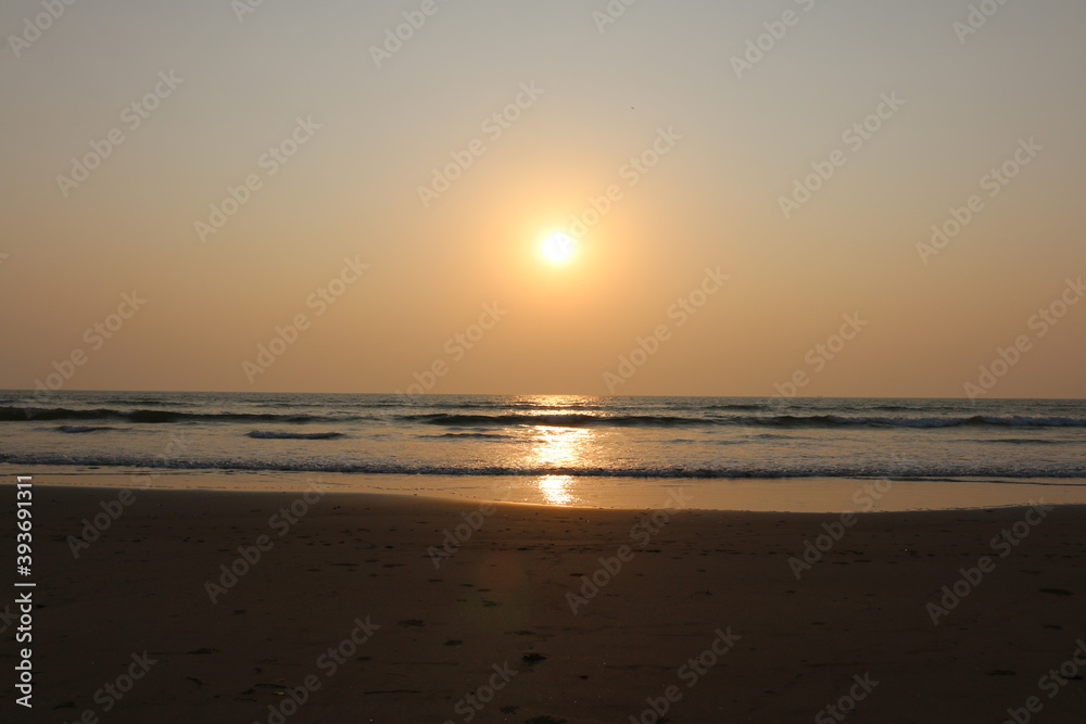 sunset on the Arabian sea on the beach India