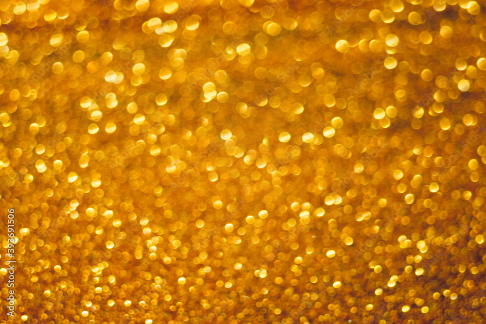 Golden glitter shiny background. Gold sparkles texture. Golden glitter shiny background. Gold sparkles texture.