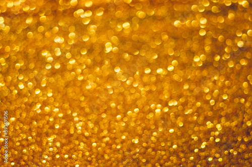 Golden glitter shiny background. Gold sparkles texture.