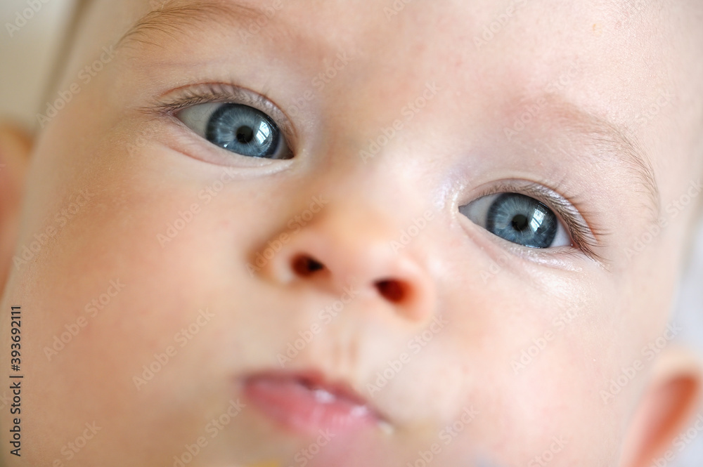 Seven month old blue-eyed baby girl in face detail. Seven month old blue-eyed baby girl in face detail.