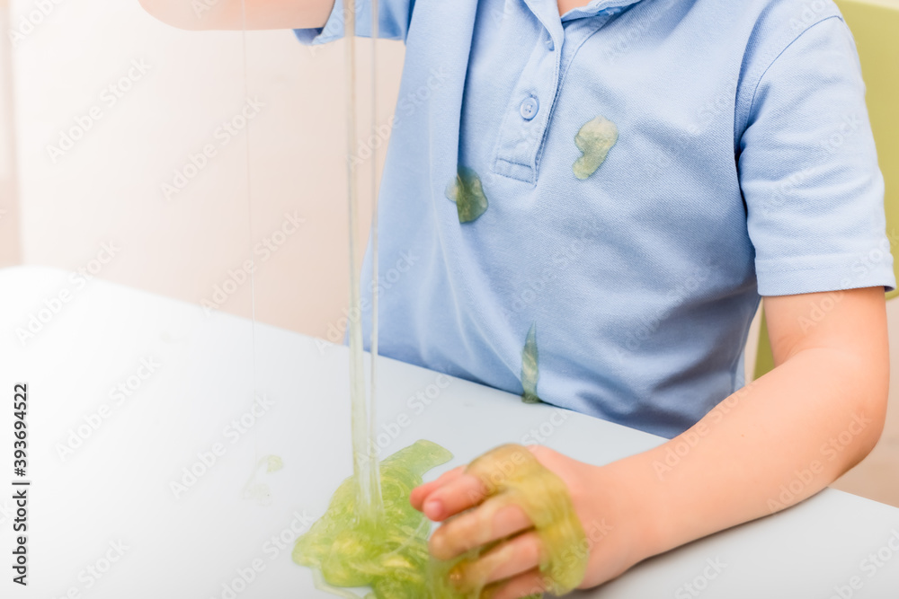slime in the child's hand. reativity and experiments slime in the child's hand. reativity and experiments
