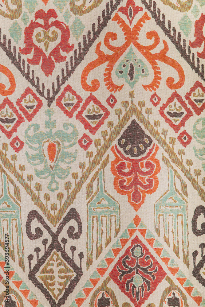 Vertical background: old multicolored fabric with patterns