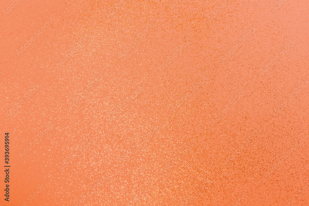 Fototapeta premium Beautiful light orange background with golden glitter. Holiday decoration concept.