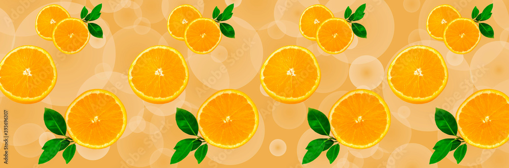 Sliced orange on a bright orange background. Oranges in the panoramic image. Panorama, a banner with space for text or insertion. Pieces of citrus fruit. Sliced orange on a bright orange background. Oranges in the panoramic image. Panorama, a banner with space for text or insertion. Pieces of citrus fruit.