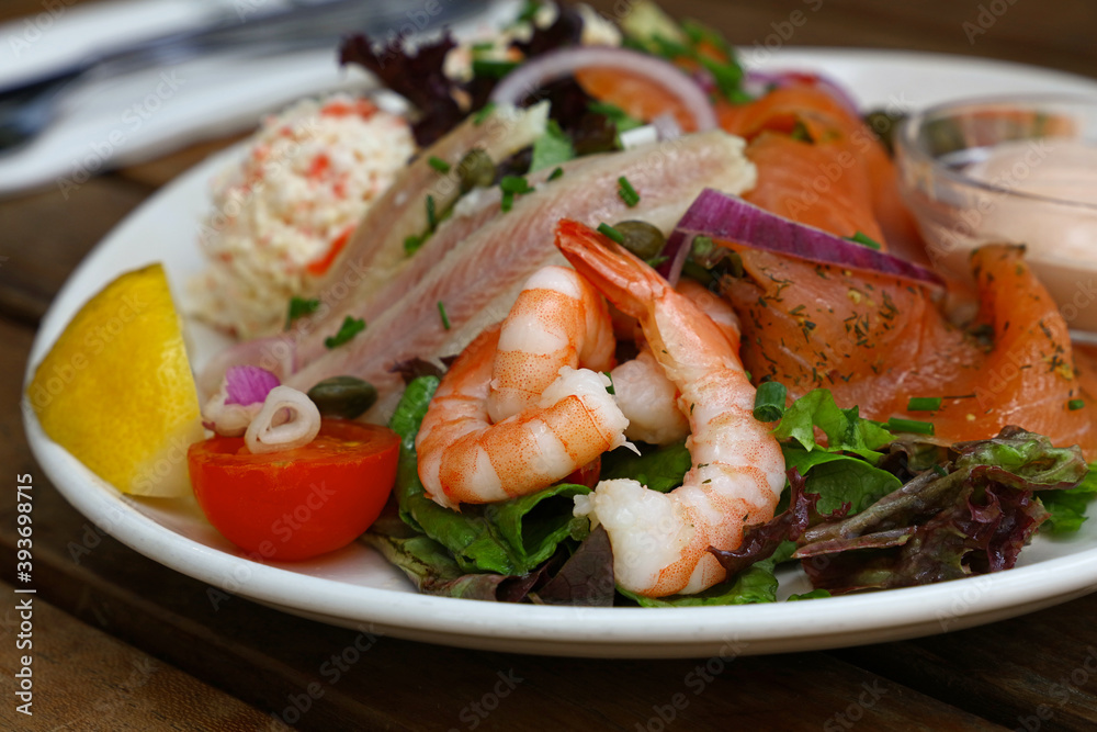 Cold and smoked seafood platter on wooden table Cold and smoked seafood platter on wooden table