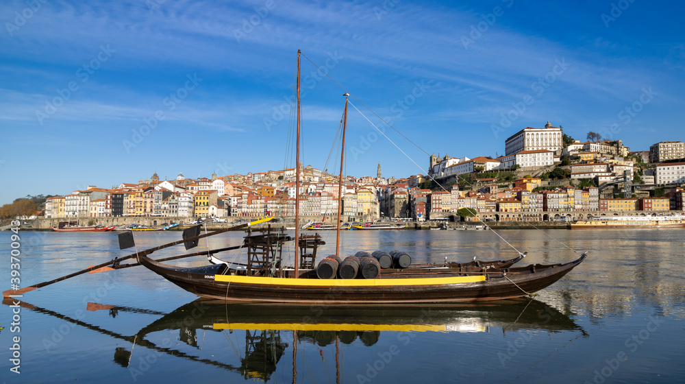 Oporto, Portugal - Porto old town cityscape- Rabelo boat in Douro river.