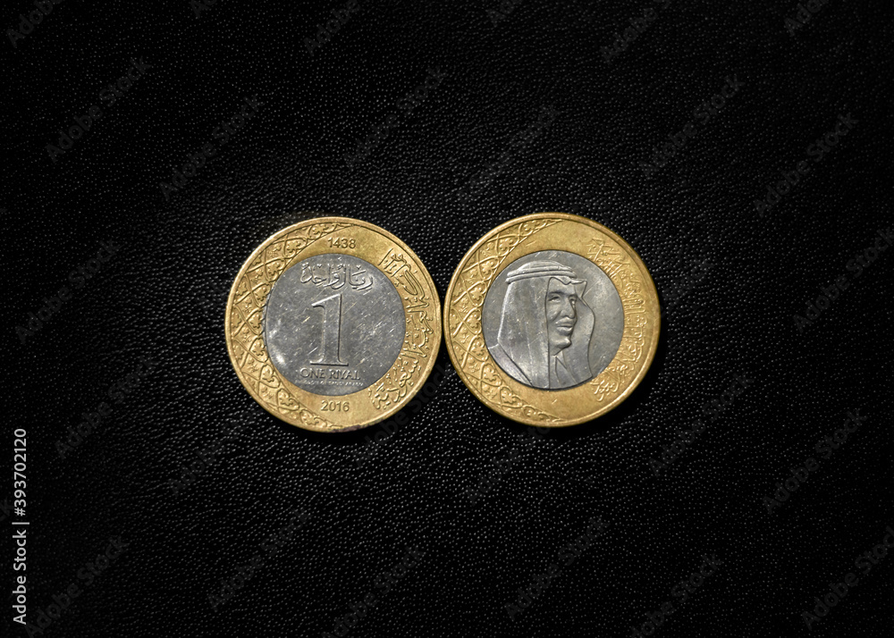 Extreme close up of Saudi Arabian and arabic islamic coins . arabic