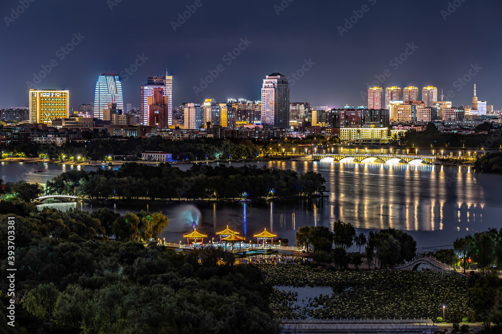 Fototapeta premium Night view of Changchun City and Nanhu Park in China