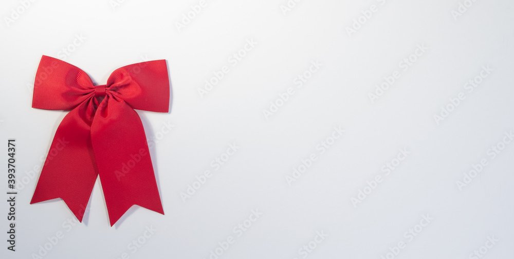 Red bow isolated on white background with lots of blank print space Red bow isolated on white background with lots of blank print space