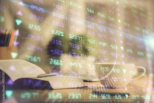 Multi exposure of forex graph drawing and desktop with coffee and items on table background. Concept of financial market trading