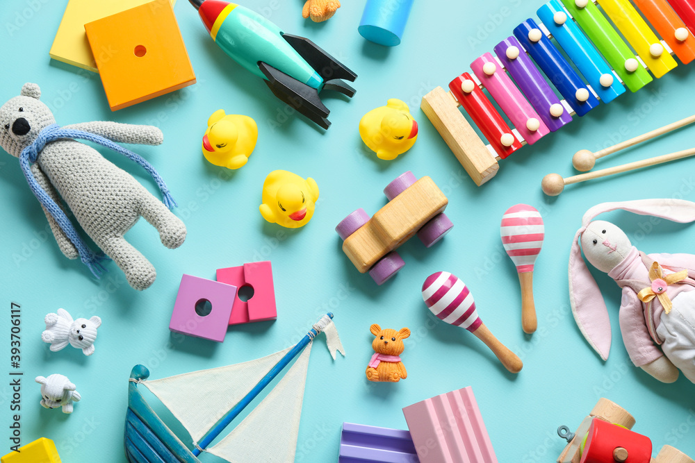 Flat lay composition with different toys on light blue background