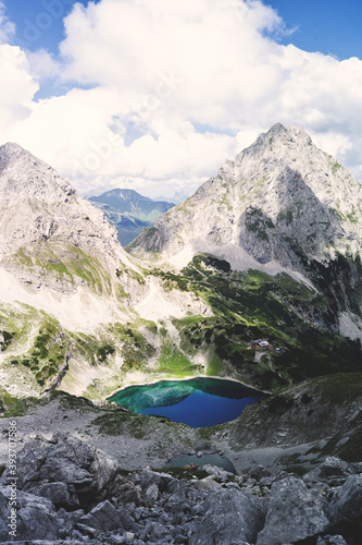 Experience the breathtaking beauty of the high alpine mountain landscape of the Zugspitze area in the Alps, with its stunning peaks and tranquil atmosphere. Perfect for outdoor activities and nature