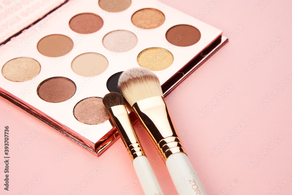 eyeshadow makeup brushes collection professional cosmetics accessories on pink background - obrazy, fototapety, plakaty 