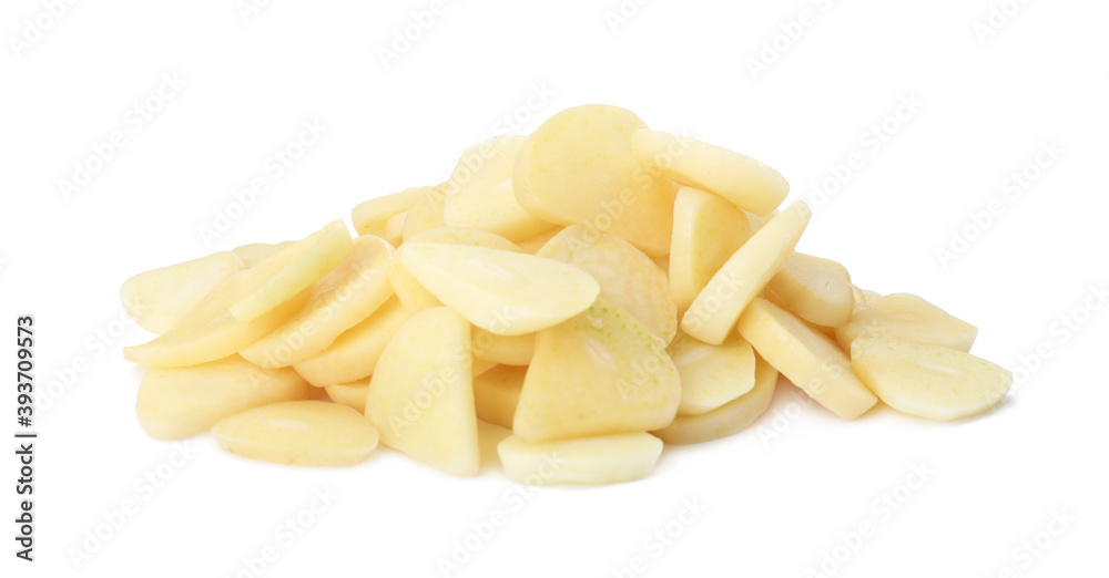 Pile of fresh sliced garlic cloves isolated on white. Organic food Pile of fresh sliced garlic cloves isolated on white. Organic food