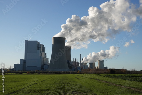 Coal-fired power station in Neurath, which generates steam from cooling towers photo