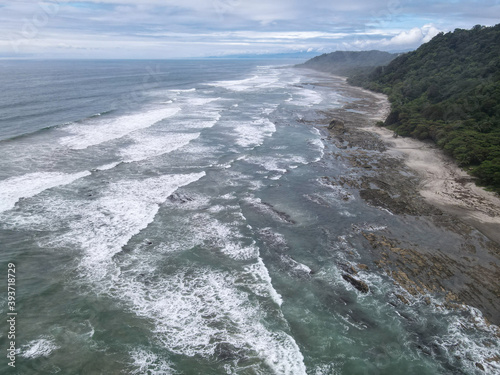   Lush Tropical Beach Paradise with blue water  great waves and rock formations in Malpais   Santa Teresa  Nicoya Peninsula Costa Rica  
