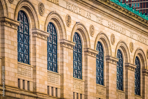 The stone and large arching windows of the original Boston Public Library