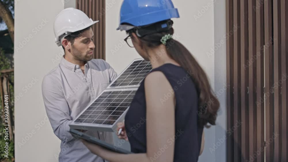 Electrical Engineer Technician Talk to business people to invest in install solar cells outside building or industrial factory. Collaboration on energy reduce for environment. Concept key worker Electrical Engineer Technician Talk to business people to invest in install solar cells outside building or industrial factory. Collaboration on energy reduce for environment. Concept key worker