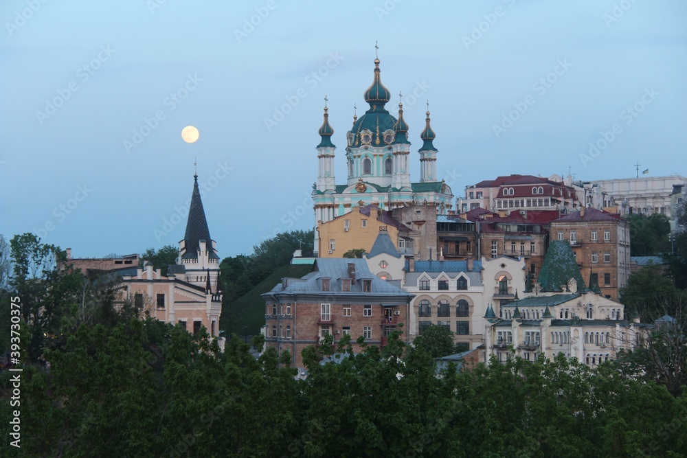 St. Andrew's Church was built in the Baroque style in 1749-1754 by the architect Rastrelli.  It is located on Andreevskaya Hill above the historical part of Podol. Full Moon. Kiev city.