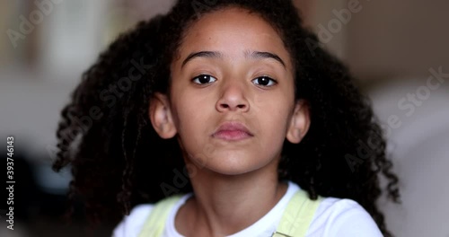 Wallpaper Mural Female mixed race child girl staring camera. Serious little kid Torontodigital.ca