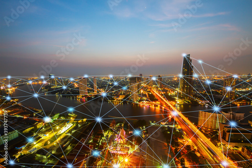Smart city at night with network connections aerial view  communication technology concept