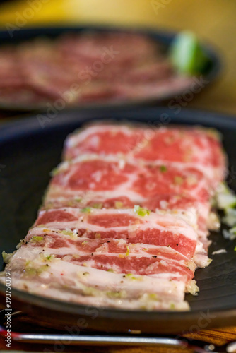 Close-up of a dish of thin-cut beef uncooked meat
