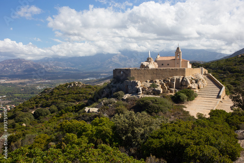 Chapel of Notre Dame de la Serra Sitting High on a Hill Near the Town of Calvi in Corsica, France photo