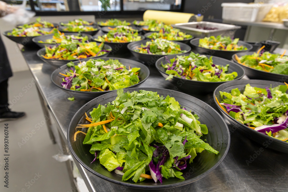 Preparation of fresh salads in a professional kitchen