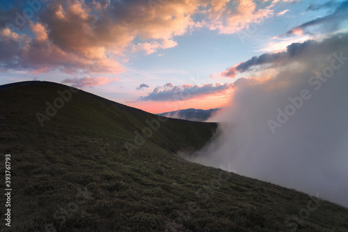 Panoramic view of the clouds high in the mountains on the mountain pass. © Myshkovskyi
