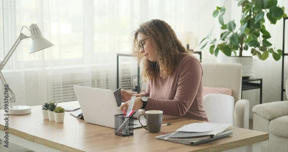 Businesswoman discussing work by video call using laptop at office Businesswoman discussing work by video call using laptop at office