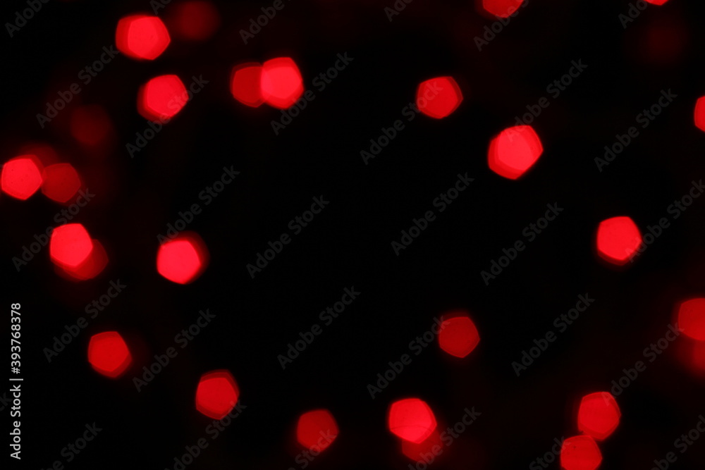 Red bokeh lights on a black background. Christmas lights texture for design Red bokeh lights on a black background. Christmas lights texture for design