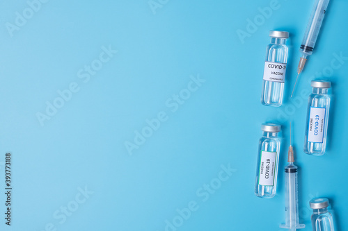 COVID-19 Vaccine vial and injection Needle Syringe against Coronavirus infection in hospital laboratory. Medical  health  Vaccination and immunization concept