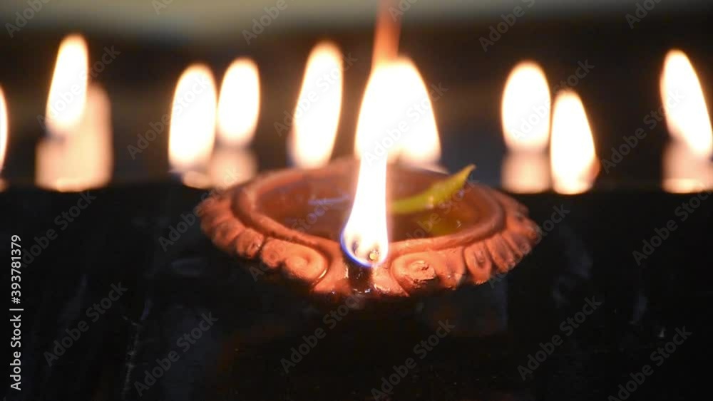Traditional Diya Lamp Lits in night at Diwali, Deepabali , Deepavali or Deepawali - the festival of lights, is widely celebrated in India and now all over the world Traditional Diya Lamp Lits in night at Diwali, Deepabali , Deepavali or Deepawali - the festival of lights, is widely celebrated in India and now all over the world
