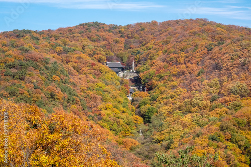Mountain temple in autumn