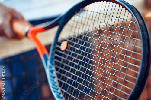 Tennis racket and tennis net on tennis court © fotofabrika