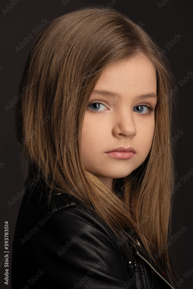 Fototapeta premium close-up portrait of beautiful girl on gray background
