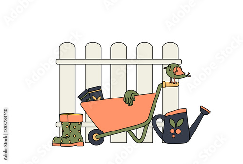 Garden wheelbarrow next to the fence and garden accessories. Concept. Garden supplies. Watering can next to the wheelbarrow and rubber boots. Gardening gloves for planting seeds. Colorful and Cartoon.