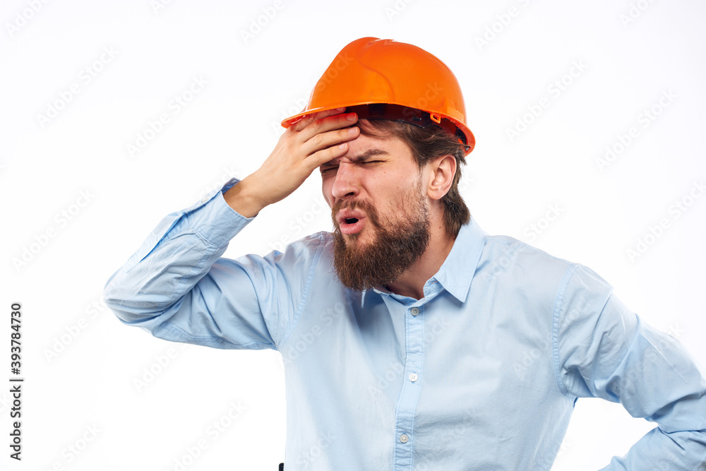Angry man in orange hard hat industry work dissatisfaction cropped view