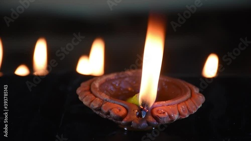 Traditional Diya Lamp Lits in night at Diwali, Deepabali , Deepavali or Deepawali - the festival of lights, is widely celebrated in India and now all over the world photo