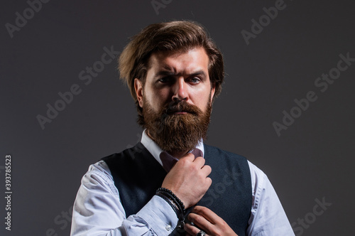 perfect look. serious bearded businessman. stylish mature man looking modern. mens office wardrobe. fashionable man dressed in suit. formal fashion model. handsome man on gray background