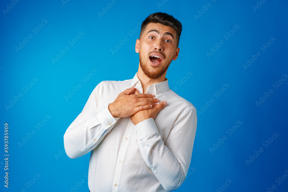 Amazed and confused bearded young man looks with astonishment. Amazed and confused bearded young man looks with astonishment.
