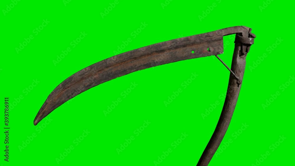 Ancient rusted metal scythe on green chromakey background Ancient rusted metal scythe on green chromakey background
