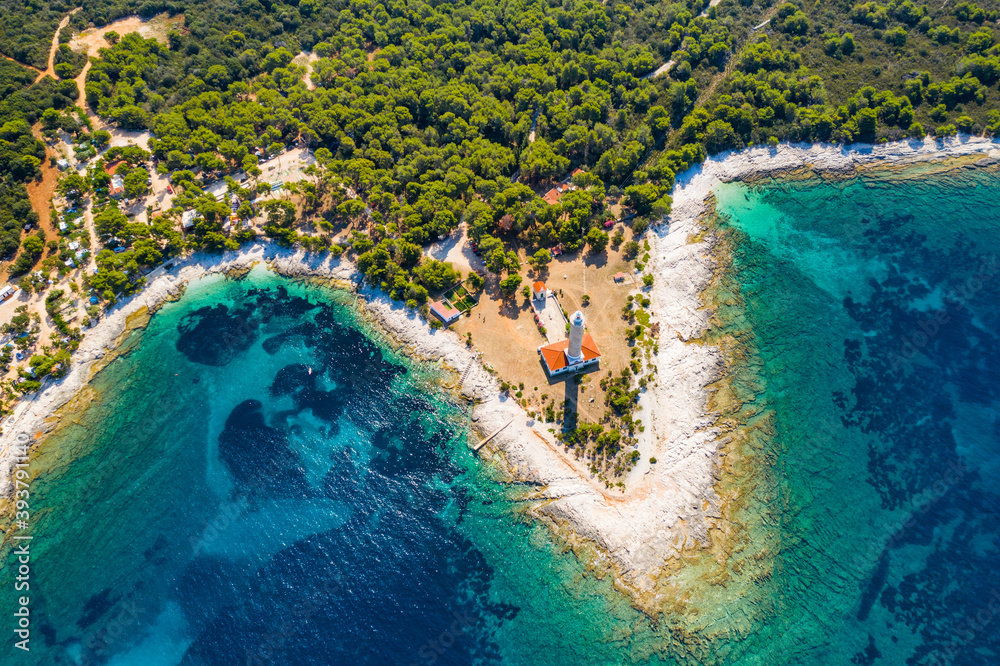 Lighthouse of Veli Rat on the island of Dugi Otok, Adriatic sea horizon in background, beautiful Croatia