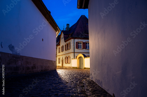 Narrow historical alley in the old town of Bamberg at night  World Heritage Site City of Bamberg  Germany