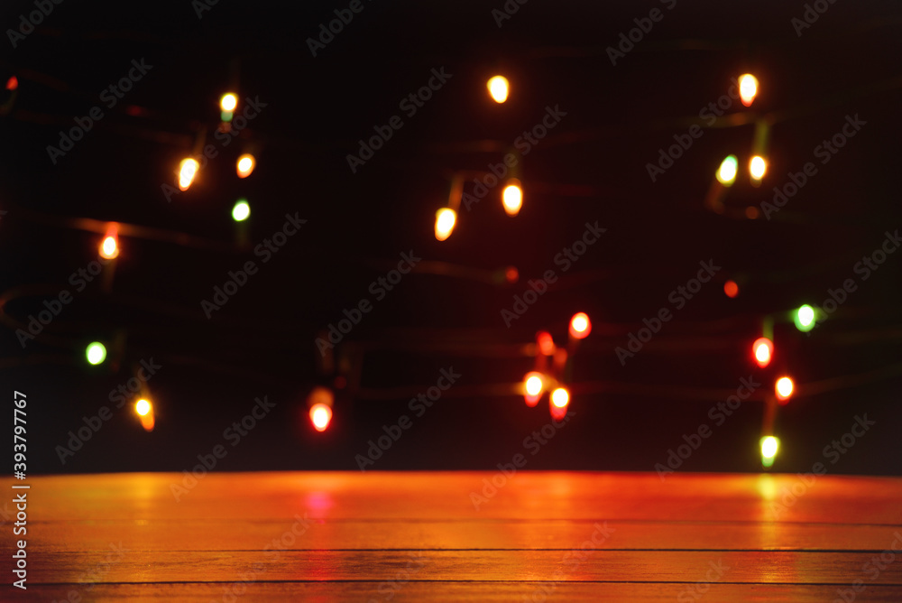 Empty wooden table with light bokeh background. Space for items on the table
