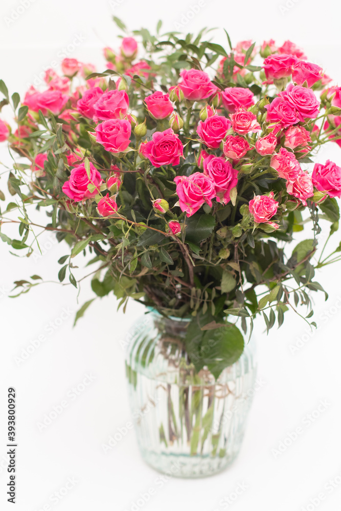 Pink spray roses bouquet in glass vase
