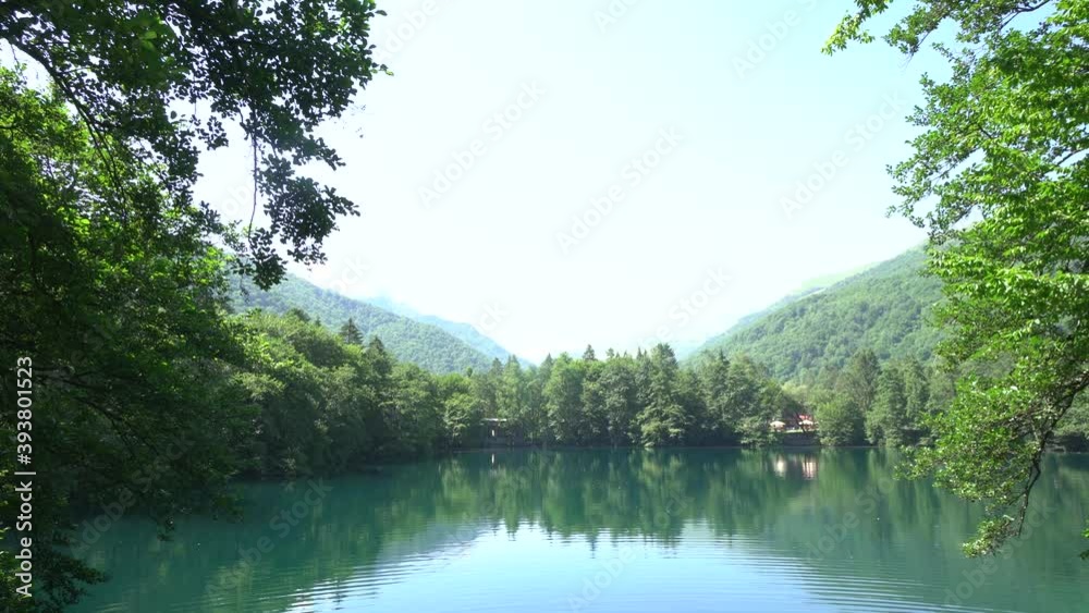 Rural lake water in sunrise morning. Sunrise forest lake view. Forest lake in sunrise. Pond surronded by mountains. Panorama. Crystal clear water. Panorama. Crystal clear water Rural lake water in sunrise morning. Sunrise forest lake view. Forest lake in sunrise. Pond surronded by mountains. Panorama. Crystal clear water. Panorama. Crystal clear water